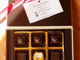 Corporate chocolate gift box with logo branding and gold wrap