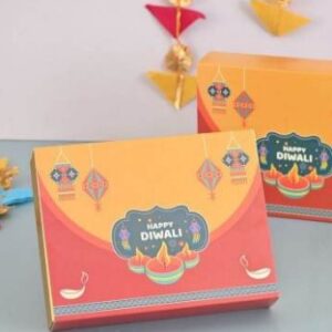 Elegant Diwali hamper box with nuts, cookies, chocolates, date bites, candle & personalized card in festive packaging