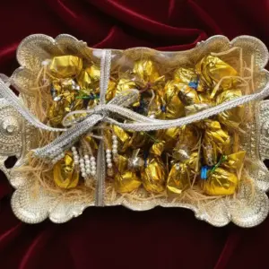 Elegant silver tray gift hamper filled with golden-wrapped assorted Chocolics chocolates arranged neatly with a decorative ribbon